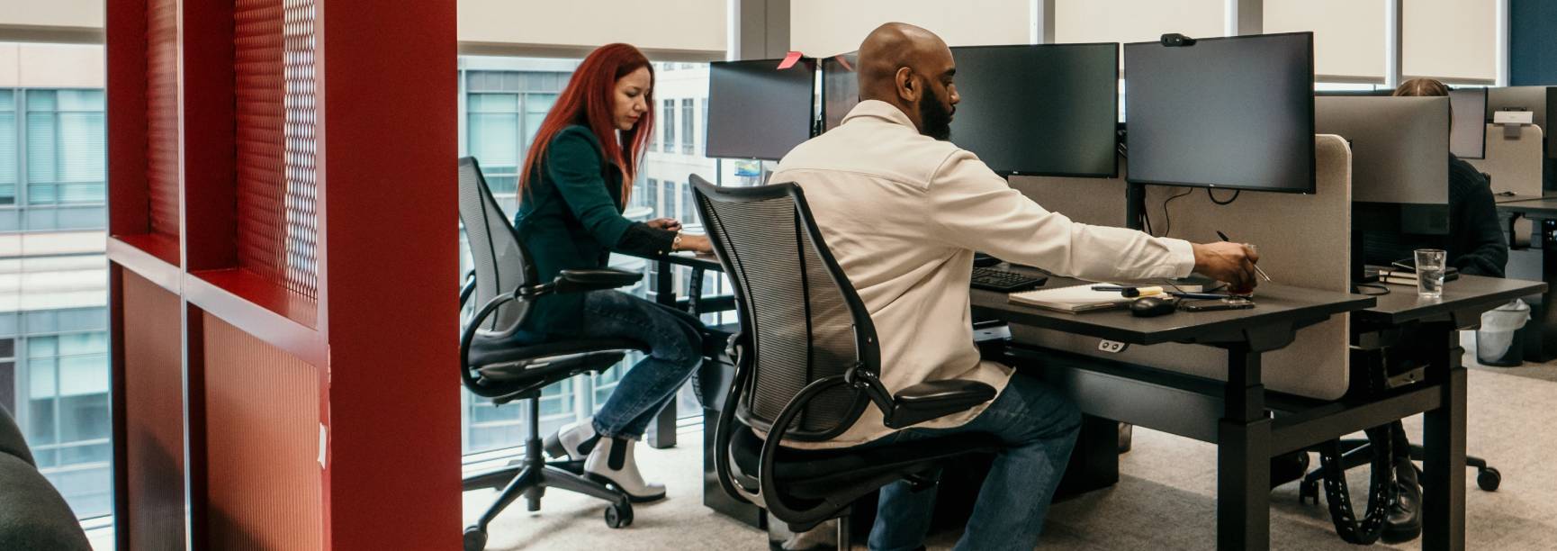 Photo of team members working on computers