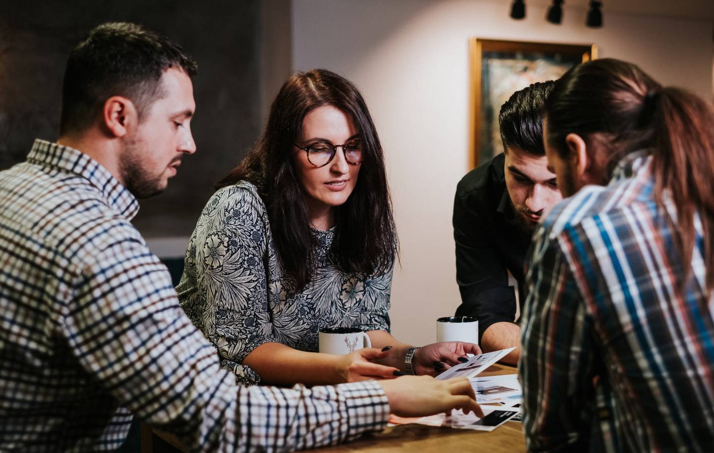 Photo of a team meeting around a table