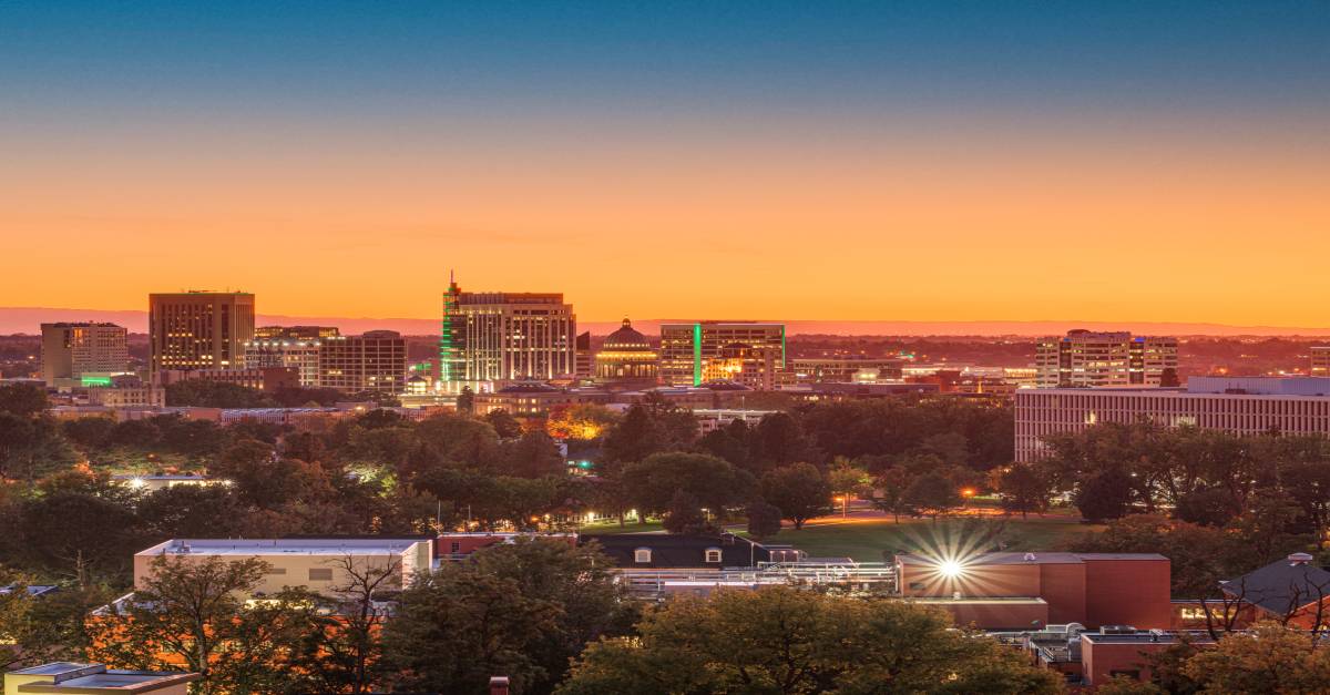 Photo of a small city skyline at sunset